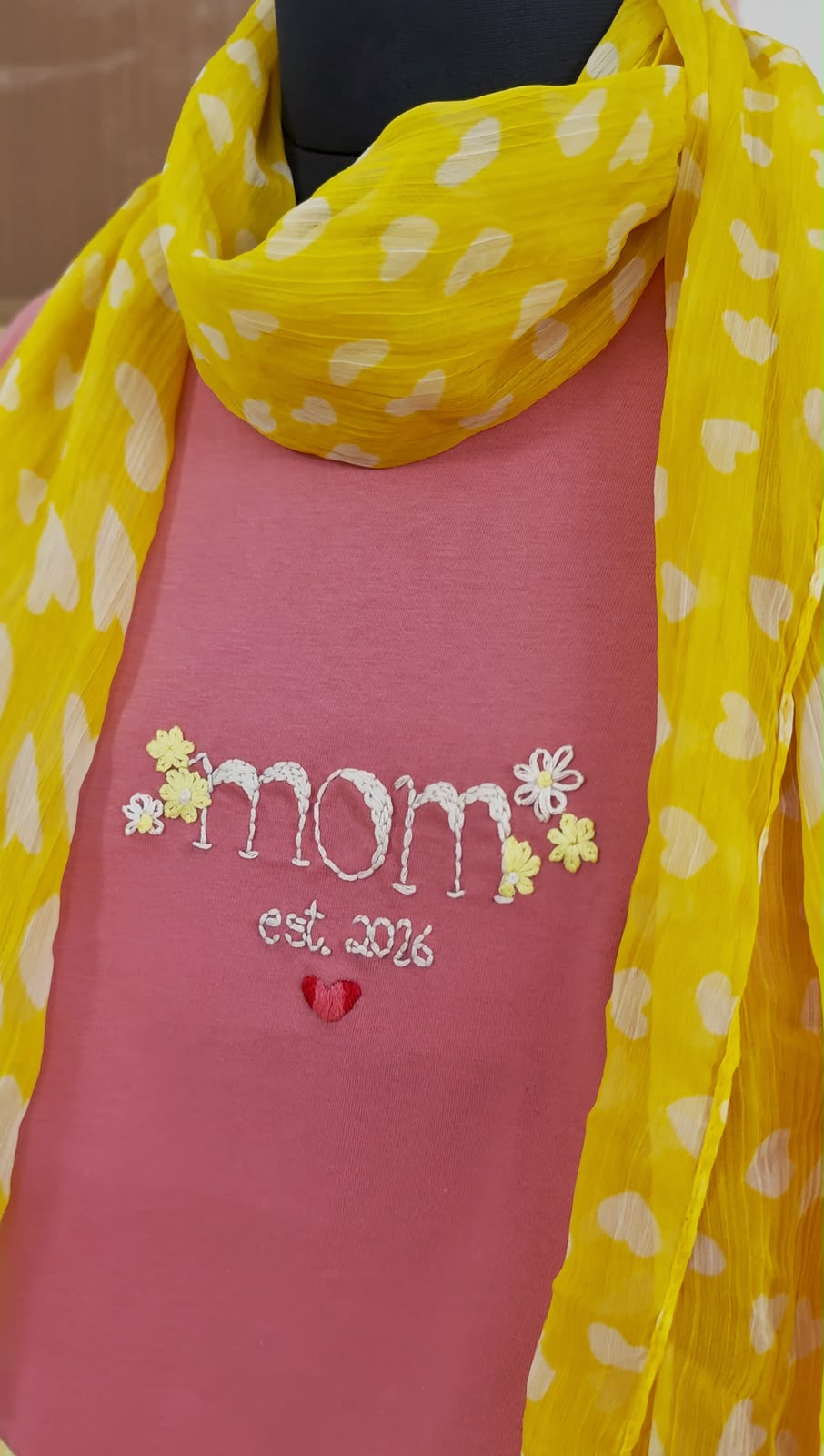 Close-up of hand embroidered floral and heart design on Mom Tee, 220 GSM cotton